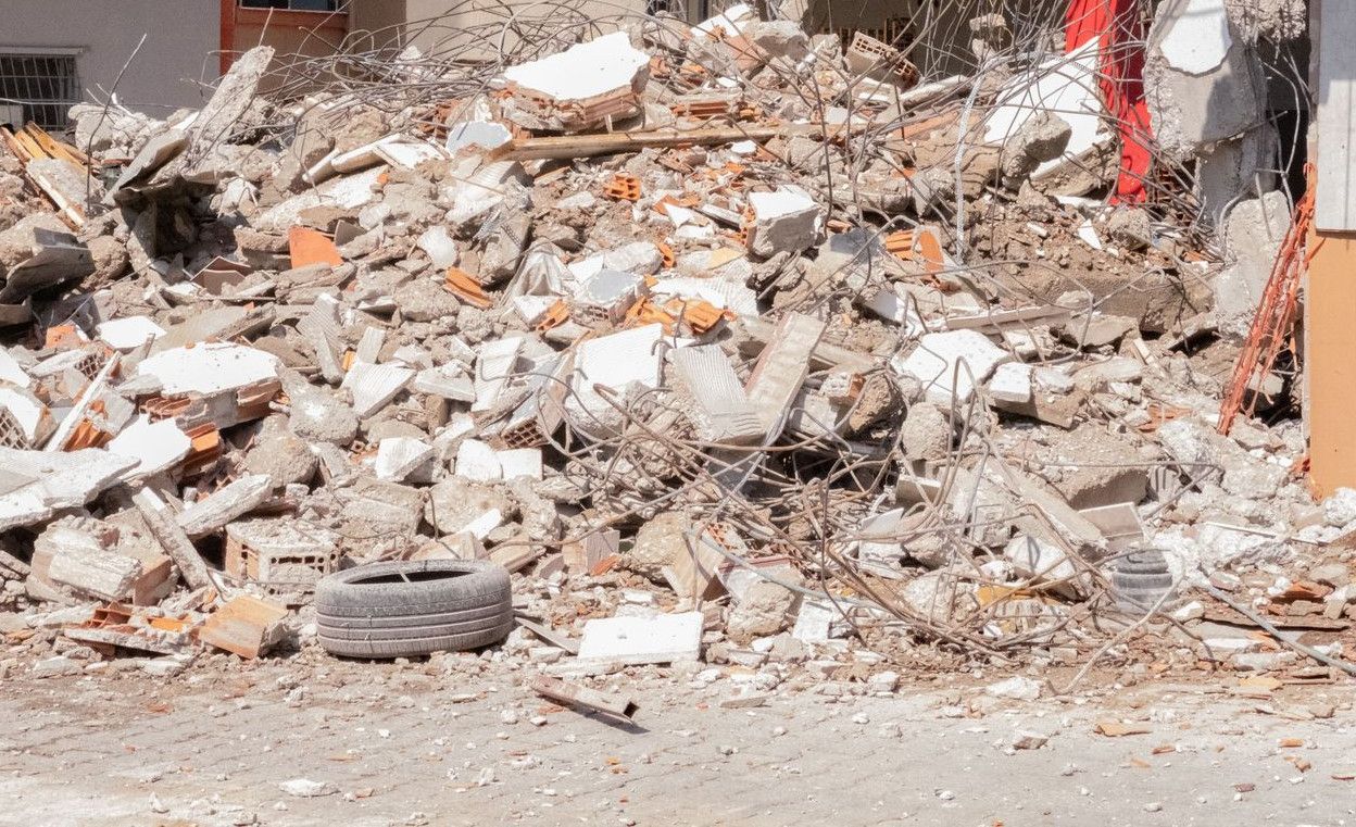 Pile of debris and rubble after demolition in an urban area in İzmir, Türkiye.